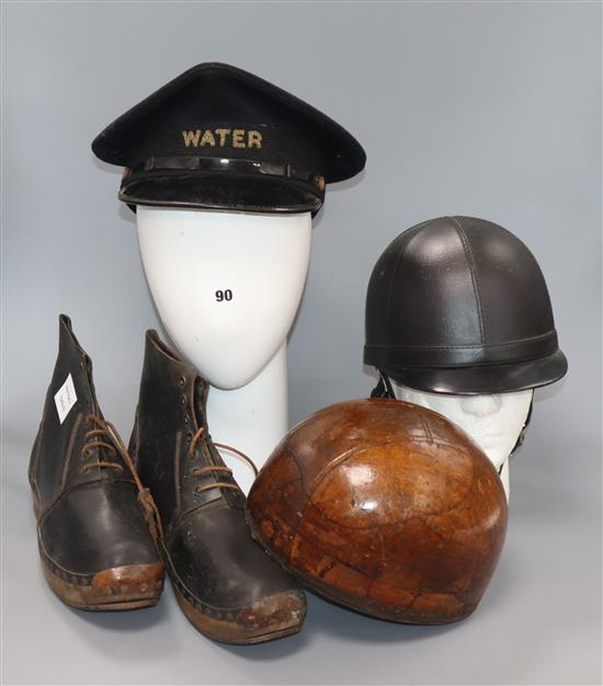 A pair of walking boots and hats, etc.